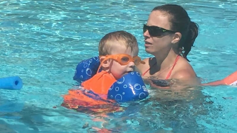 Christi Brown holds onto her son Judah in a pool. Judah drowned a decade ago after his mother...