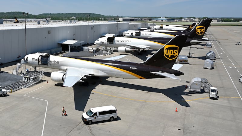 FILE - United Parcel Service transport jets wait to be loaded with packages at the UPS...