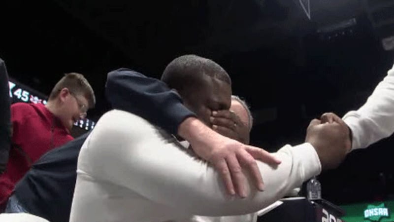 Lakota West High School Boys Basketball Coach Kelven Moss is overcome with emotion Sunday at...