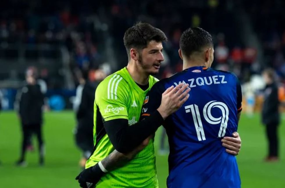 FC Cincinnati goalkeeper Roman Celentano (18) embraces FC Cincinnati forward Brandon Vázquez...