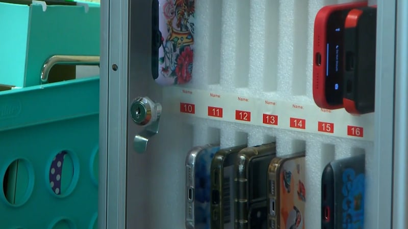 Phones being locked up as part of a ban in schools