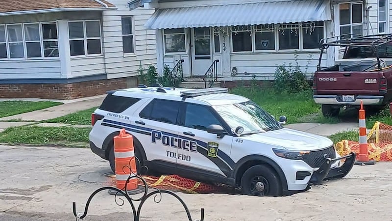 A Toledo Police cruiser hit a hole in the road on Asbury during a police pursuit on July 10,...