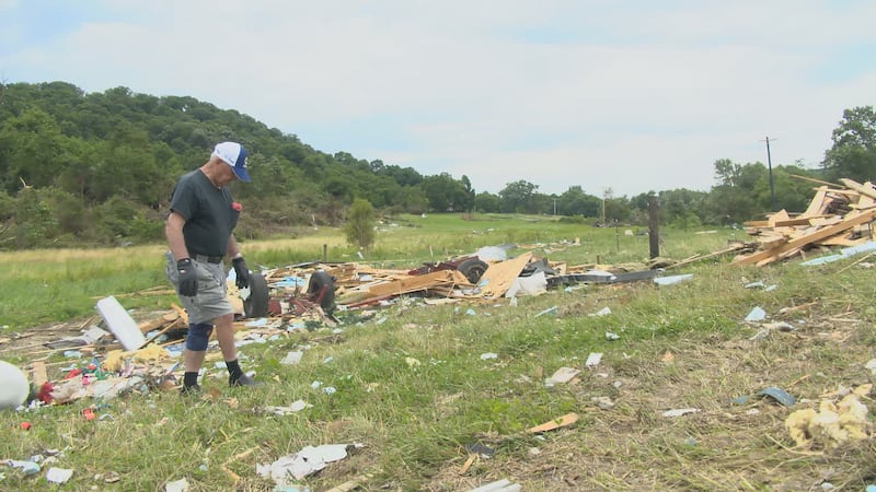 One week after tornadoes destroyed homes, residents are clearing debris with help from volunteers