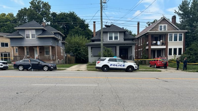 Police have crime scene tape around two homes on Madison Road near the Millsbrae Avenue...