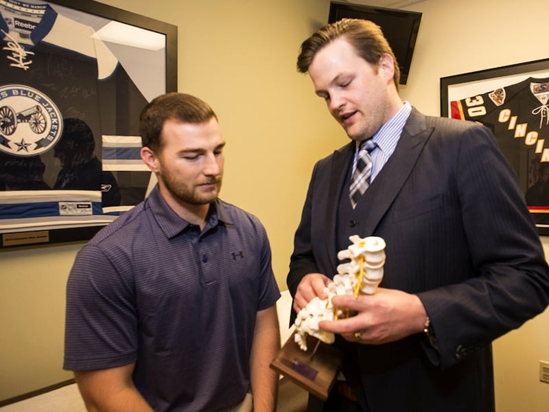 Dr. Michael Planalp treats a patient for a spinal injury at Beacon Orthopaedic.