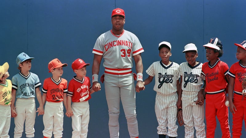 Cincinnati Reds Dave Parker joins hands with Pittsburgh area little leaguers during a pre-game...