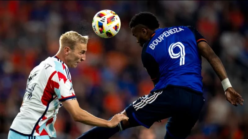 Chicago Fire defender Tobias Salquist (14) heads the ball away from FC Cincinnati forward...