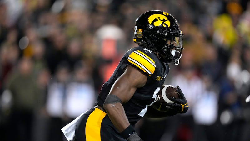 Iowa running back Kaleb Johnson (2) runs up field during the second half of an NCAA college...