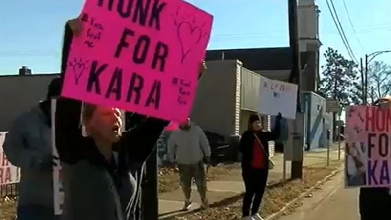 Family, friends, and neighbors of Kara Hyde gather outside in Hamilton for the "Honk for Kara...