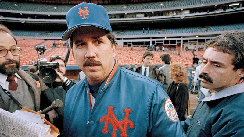 FILE - New York Mets Manager Davey Johnson talks with reporters prior to the opening game of...