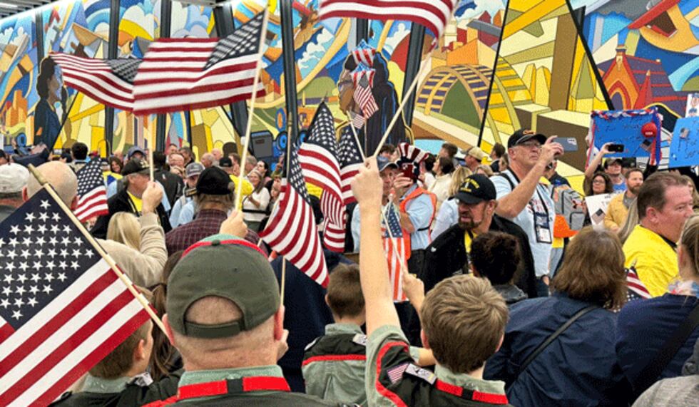 Families and friends welcome back veterans from the final Honor Flight of 2023 at...