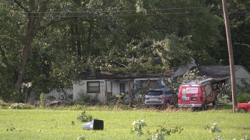 Residents on Parkers Run Road help each other after fast-moving storm causes widespread damage