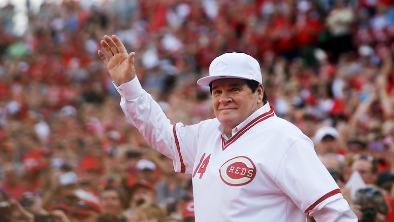 In this June 24, 2016, file photo, former Cincinnati Red Pete Rose waves to the crowd as he is...