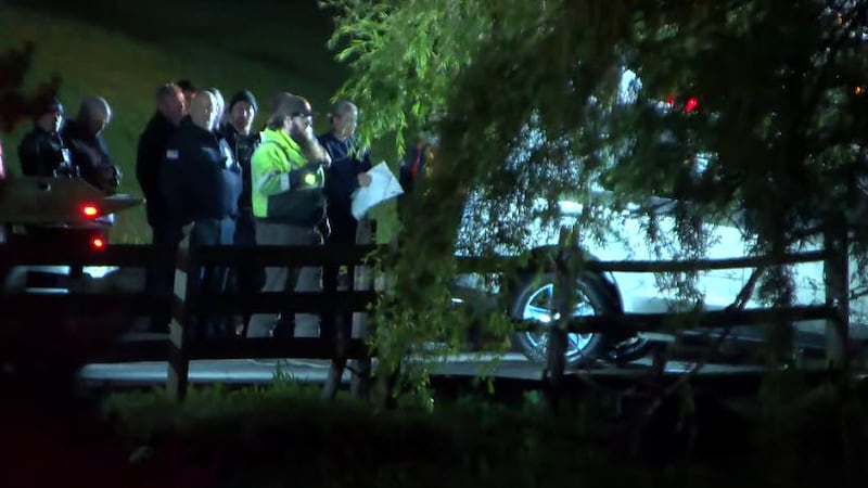 Divers pulled this white SUV from a pond off Manchester Road in Middletown early Thursday.