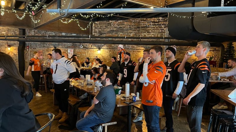 Fans at Lucius Q watch the Bengals during the playoff season.