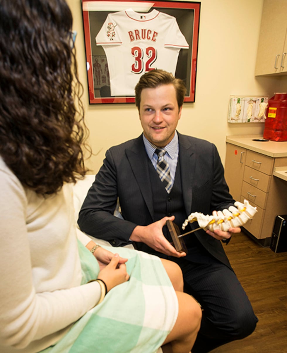 Beacon Orthopaedic Dr. Michael Planalp treats a patient at his clinic.