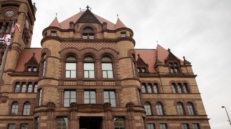 About 100 people gathered outside Cincinnati's City Hall Tuesday, March 4 to protest the...