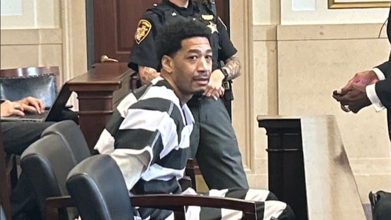 Lamont Brewer waits in handcuffs for his case to be called in Hamilton County Common Pleas...