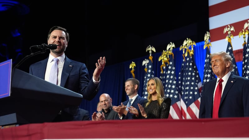 Republican presidential nominee former President Donald Trump listens as Republican vice...