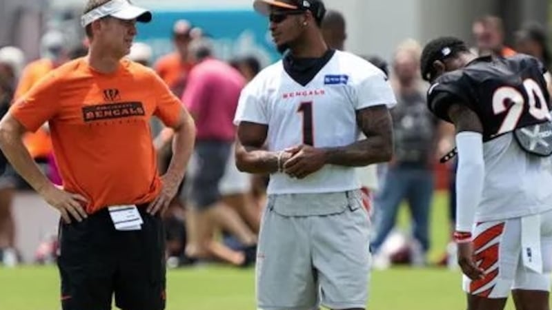 Bengals star Ja'Marr Chase hangs out with coaches and players during their training camp on...
