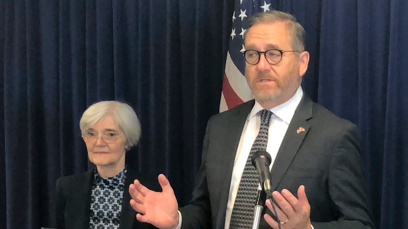 FILE - In this June 3, 2019, file photo, Ohio Attorney General David Yost, right, speaks a...