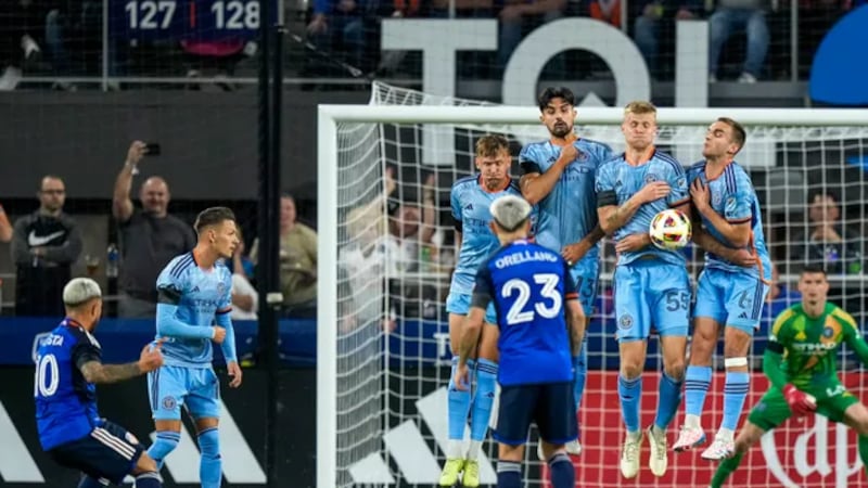 New York City defends a kick from FC Cincinnati midfielder Luciano Acosta (10) in the first...