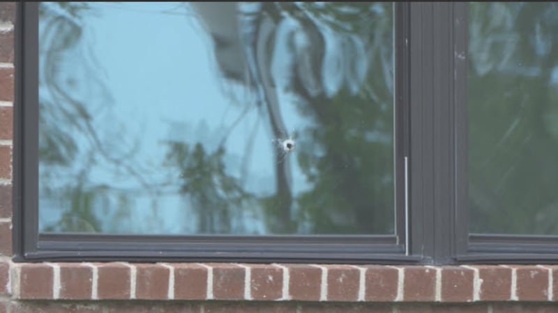This bullet hole is visible on the house in the 4800 block of Granada Court in Liberty Township.