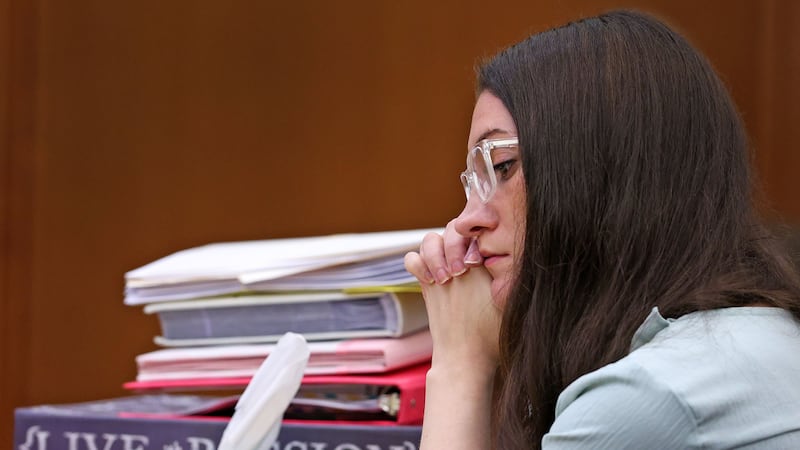 Lindsay Clancy listens to her mother Paula Musgrove on the witness stand during her murder...