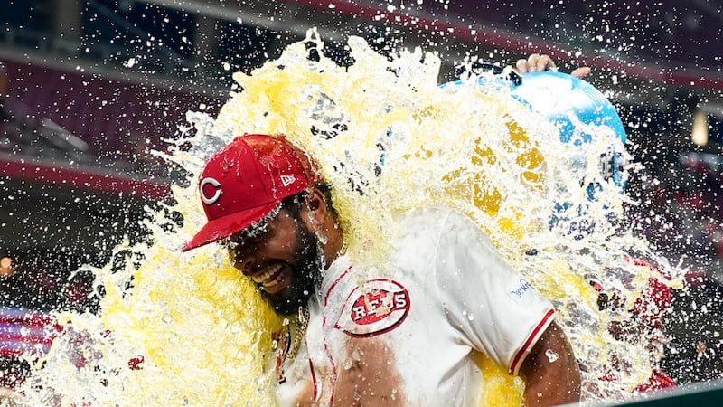 Cincinnati Reds' Rece Hinds, center, is doused by teammates following the team's 6-0 victory...