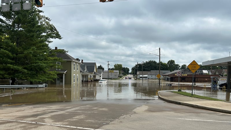 Floodwaters left Connersville divided, with road closures and a main bridge connecting parts...