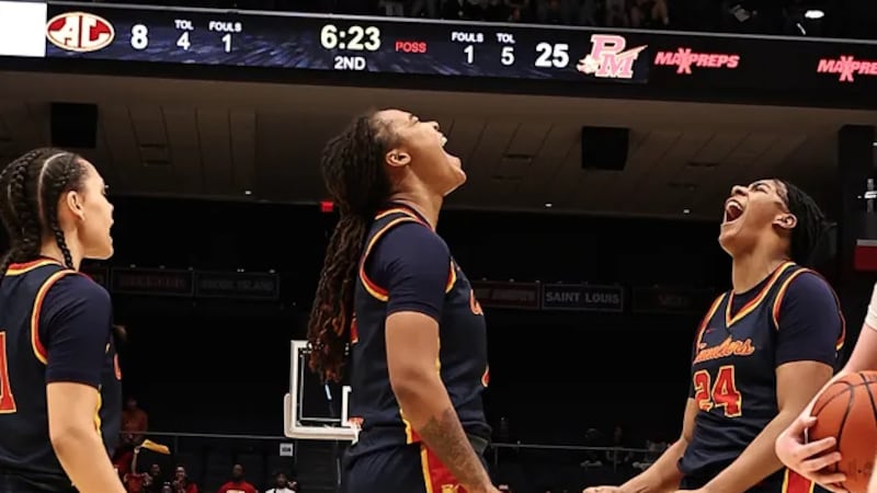 Dee Alexander and Samaya Wilkins react during the Cavaliers' state championship game against...