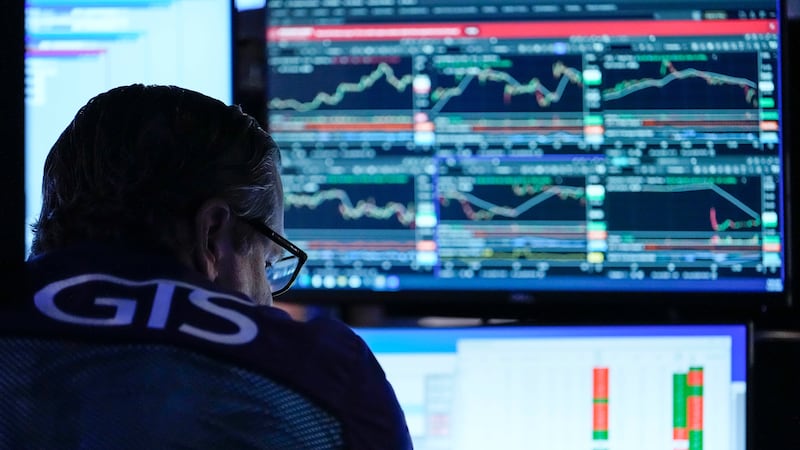 A trader works on the floor of the New York Stock Exchange, Thursday, July 30, 2026, in New York.