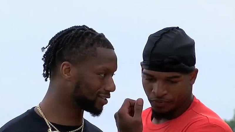 Bengals wide receiver Ja’Marr Chase (right) was on hand to show support for former teammate...