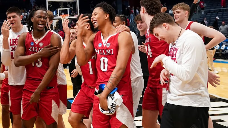 Miami (OH) RedHawks players and staff celebrate after defeating the Southern Methodist...