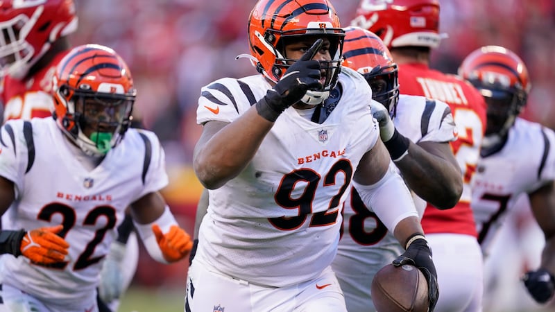 Cincinnati Bengals defensive end B.J. Hill (92) celebrates after intercepting a pass during...