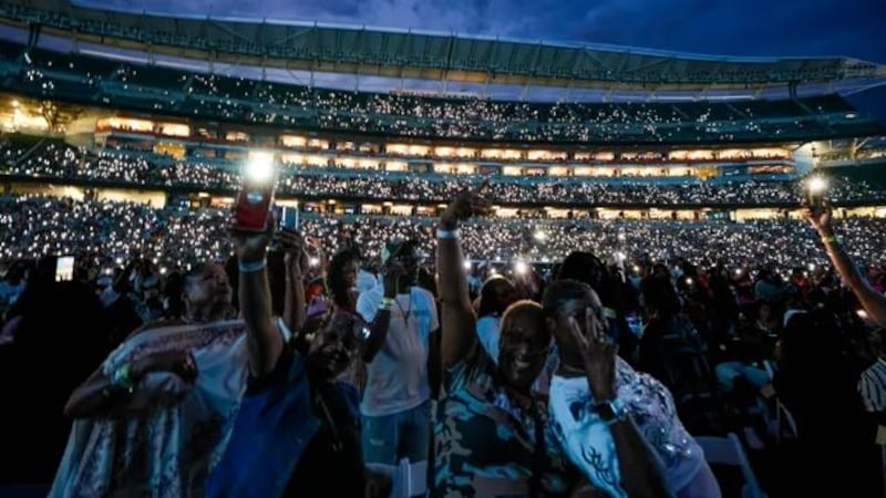 Fans wave their cell phone lights as Charlie Wilson performs during the annual Cincinnati...