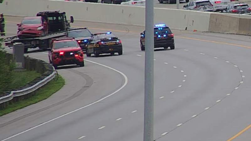 A red vehicle towed away after a shooting on Interstate 71 killed a 22-year-old on May 21.
