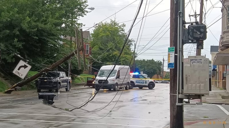 Electrical poles fall on traffic lights and power lines after Tuesday night's storms in...