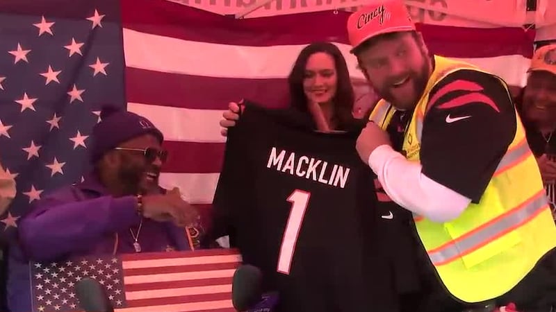 Ted Karras gifts Army veteran Chris Macklin his own Bengals jersey after helping build a ramp...