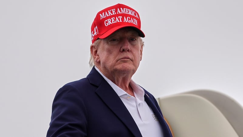 President Donald Trump boards Air Force One at Morristown Airport, Sunday, Aug. 16, 2026, in...
