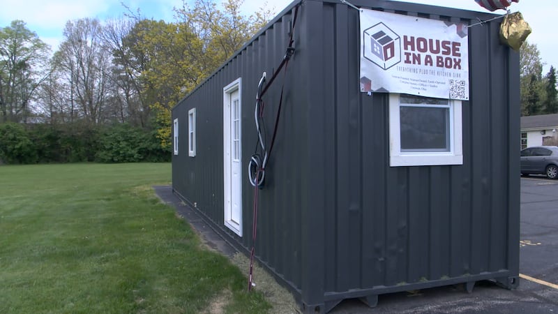 The container home has a full-size kitchen with room for a washer and dryer.