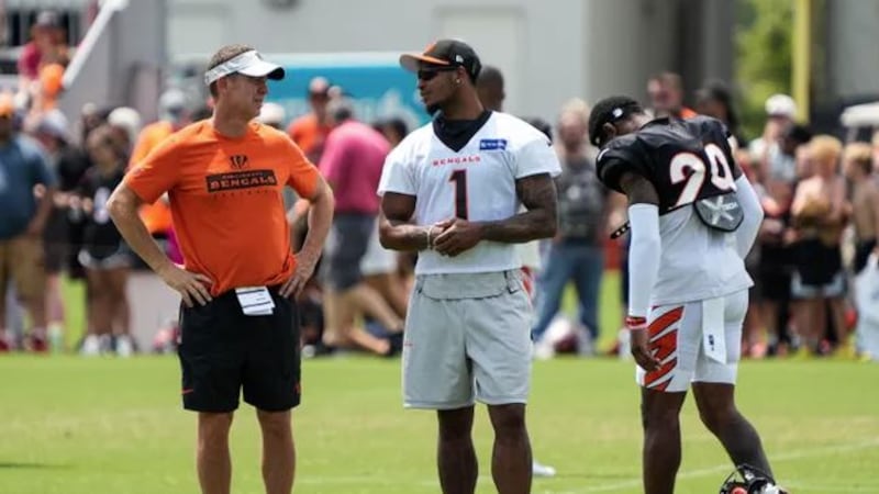 Bengals star Ja'Marr Chase hangs out with coaches and players during their training camp on...