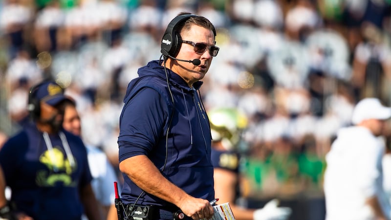 Notre Dame defensive coordinator Al Golden looks towards the field during the first half of an...