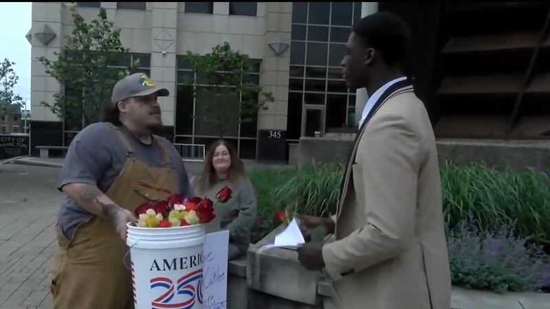 Thursday was a day of sadness and remembrance for Joshua Eversole, as he handed out flowers in...