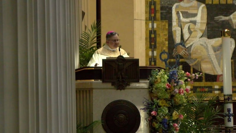 The Archbishop of Cincinnati, Robert Casey, held a mass in honor of the newly elected pope,...