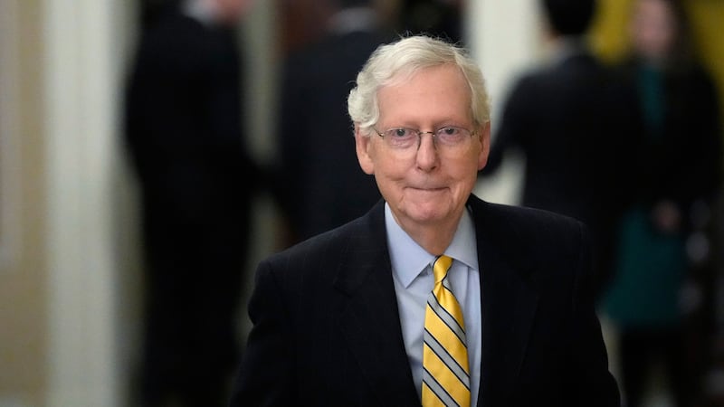 Senate Minority Leader Mitch McConnell of Ky., walks back to his office following a meeting...