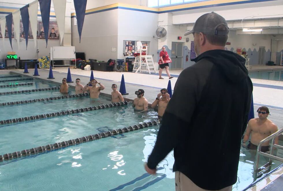 Retired Chief Master Sergeant Aaron May watches on as recruits go through training.