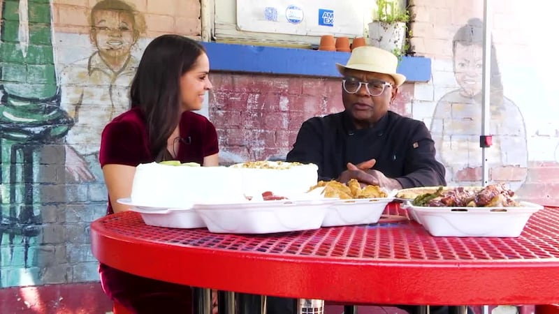 Host Sarah White talks to Marvin Smith, owner and grill master at Ollie's Trolley in...