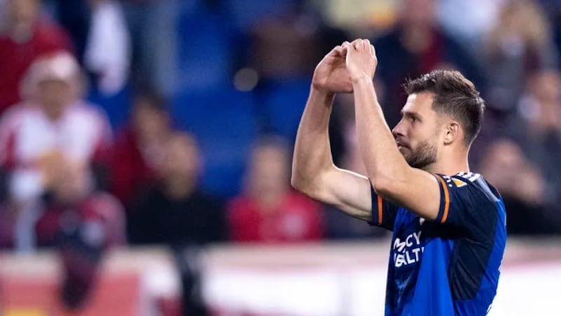 Matt Miazga of FC Cincinnati signals to fans after making a penalty kick against the New York...
