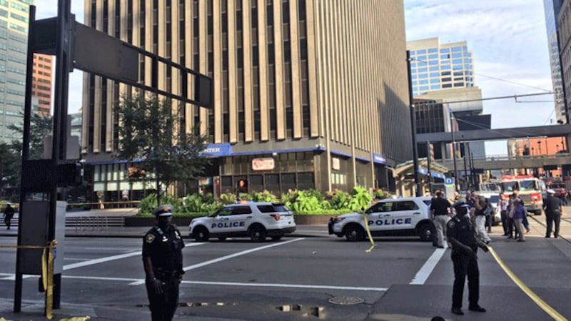 Cincinnati police secure the area around Fountain Square and Fifth Third Center the morning of...